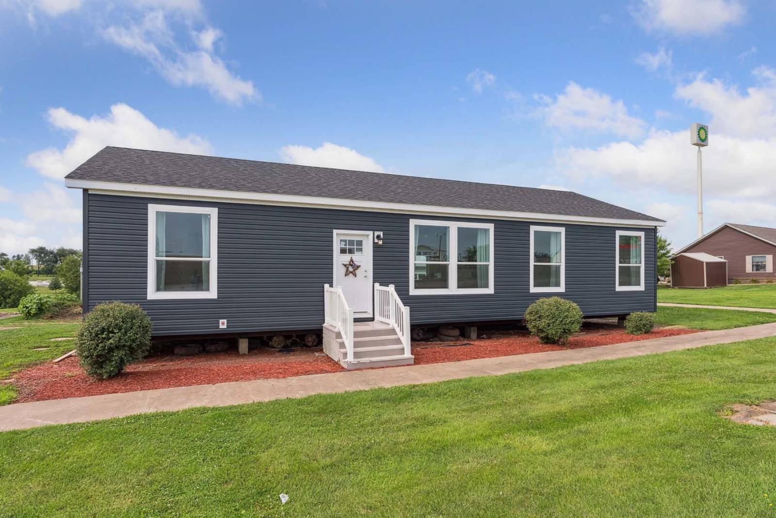 Manufactured home being positioned on a prepared residential lot